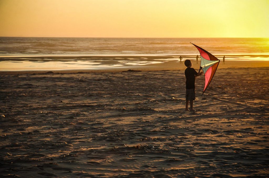 Flying a kite on the beach