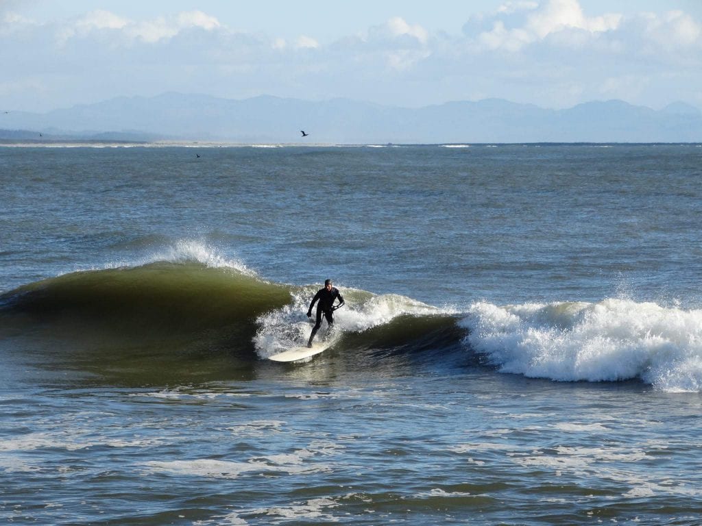 Man Surfing on the Long Beach Peninsula