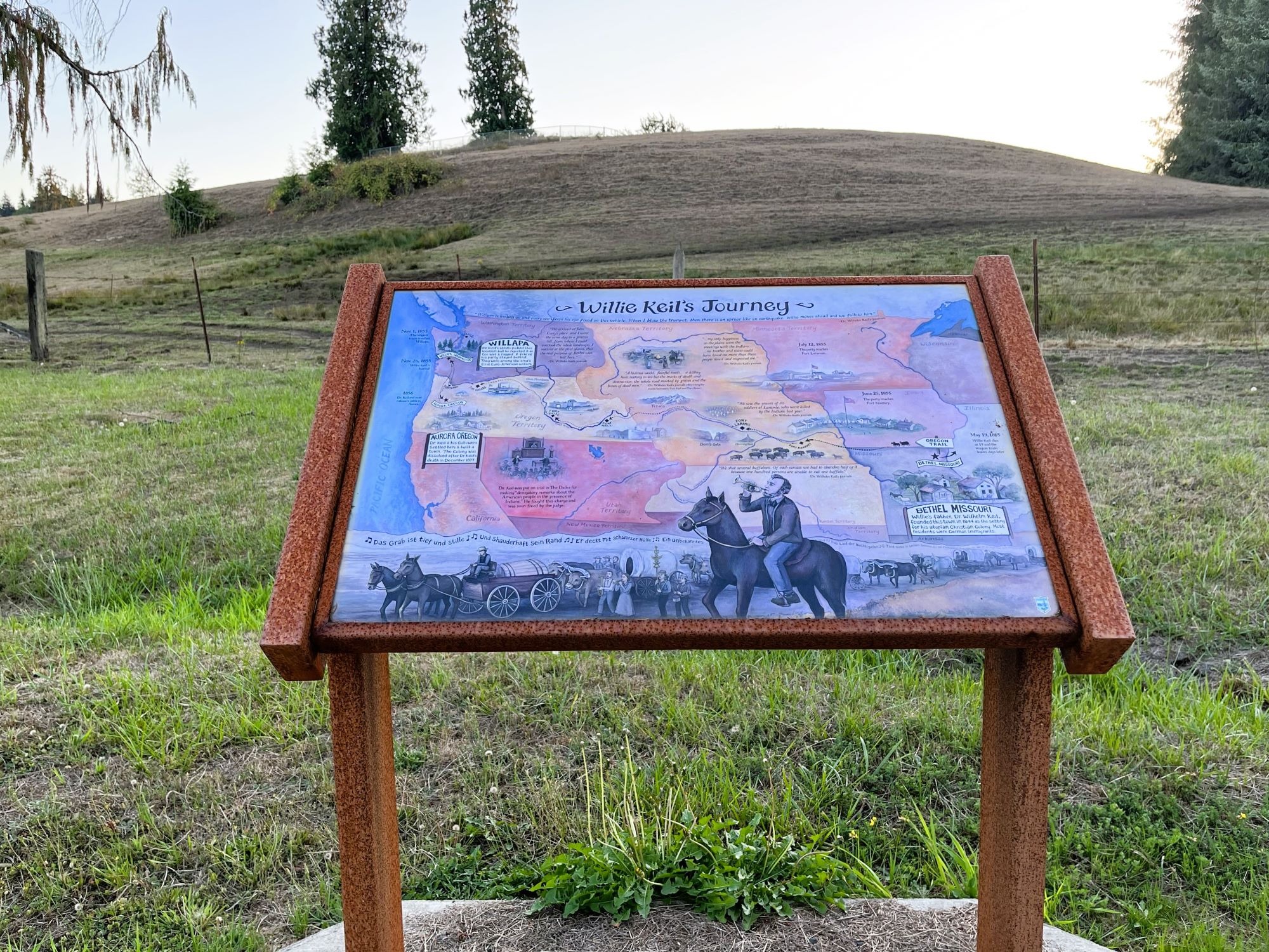 The Pickled Pioneer heritage marker near Raymond, WA, commemorates the legendary journey of Willie Keil, a preserved pioneer who traveled west after his death.